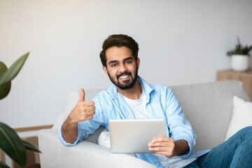 Handsome Arab Man Using Digital Tablet At Home And Showing Thumb Up