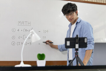 Asian university teachers are teaching mathematics with smart phone to record live on internet, Long-distance study due to the virus epidemic situation, Online remote learning, Quarantine for people.