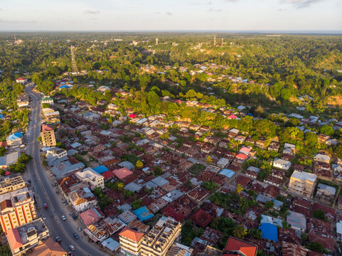 Aerial Drone shot of Chake Chake City, a Capital of Pemba island, Zanzibar archipelago. City in a river Delta at sunset time
