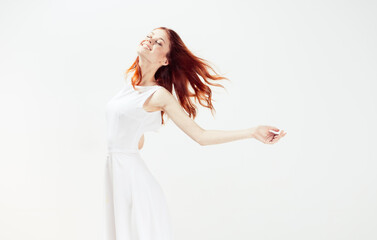 woman in white dress red hair glamor movement
