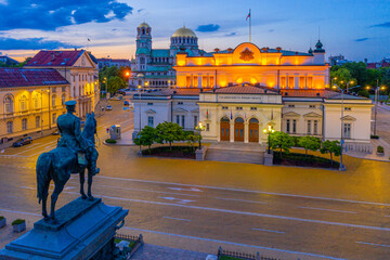 Night view of the National Assembly of the Republic of Bulgaria and Alexander Nevski cathedral in...
