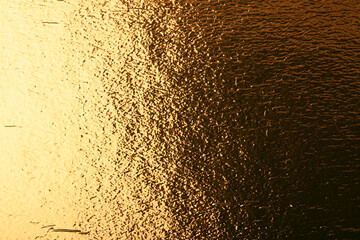 Abstract stylish geometric background. Growing diagonals, gradient. Trendy gold colors. Copy space.