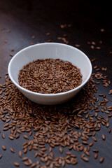 flax seeds in a white plate on the table