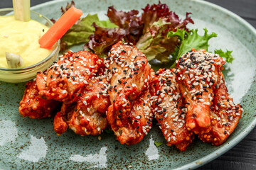 Chicken wings. Traditional asian recipe. Dark background