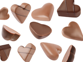 Delicious heart shaped chocolate candies falling on white background