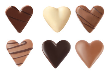 Set with delicious heart shaped chocolate candies on white background