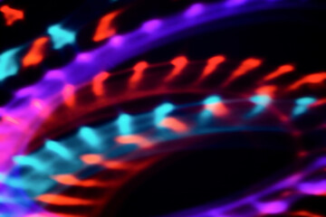 Blur colorful neon light leaks on black background. Defocused illuminated abstract futuristic...