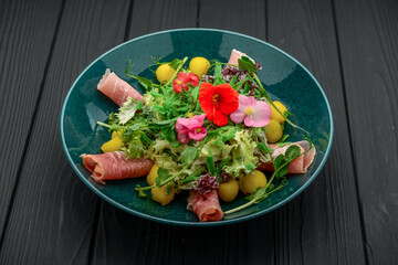 salad with parma ham, jamon, tomatoes and arugula