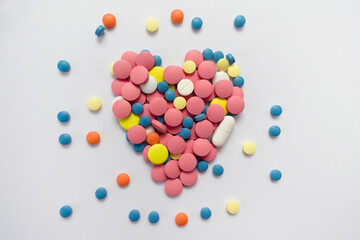 Heart of pills on a white background.Medicine background.
