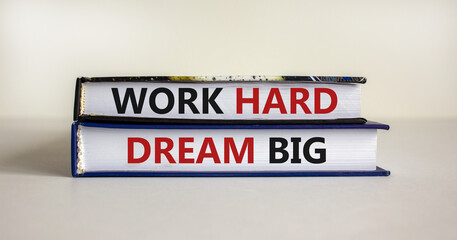Obraz premium Work hard dream big symbol. Concept words 'Work hard dream big' on books on a beautiful white background. Business, motivational and work hard dream big concept.
