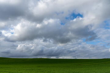 Stock photo of rural landscape against blue sky.