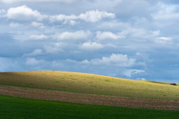 Fototapeta premium Stock photo of rural landscape against blue sky.