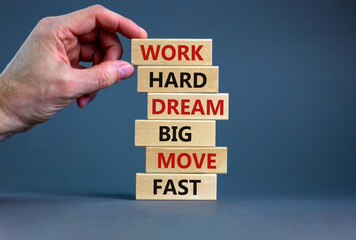 Work hard dream big symbol. Words Work hard dream big move fast on wooden blocks on a beautiful grey background. Businessman hand. Business, motivational and work hard dream big move fast concept.