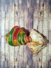 Croissant on wooden background