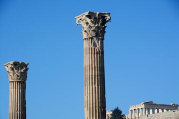 Fototapeta na wymiar Athens is the cradle of classical civilization and philosophy. Also for the architecture temples, columns and capitals have spread in the Mediterranean civilizations. Here the Temple of Olympian Zeus.
