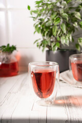 hibiscus tea,rose tea ceremony. Cup of freshly brewed fruit tea, light moody. the bright interior