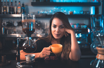 person drinking coffee in bar