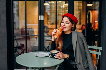 Girl drinking coffee in the cafe.