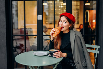 Girl drinking coffee in the cafe.