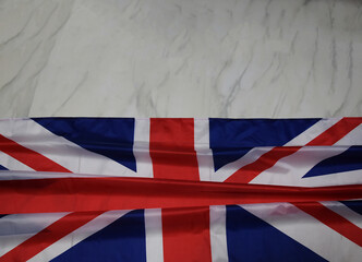 Great Britain flag on marble background, top view, place for your text. The modern British flag...