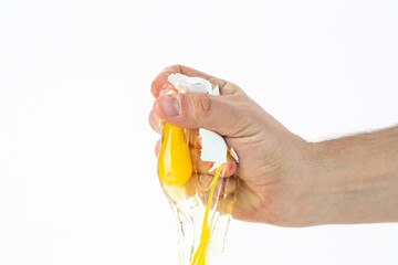 Brocken fresh egg in hand