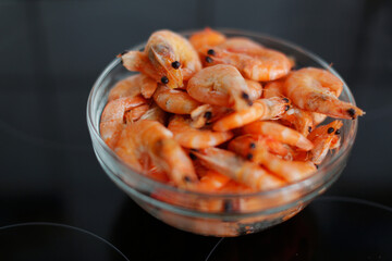 shrimp in a bowl on a black background