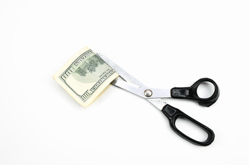 Scissors cut the dollar, on an isolated white background