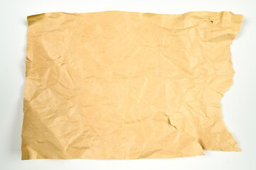 Yellow crumpled, torn paper on isolated white background