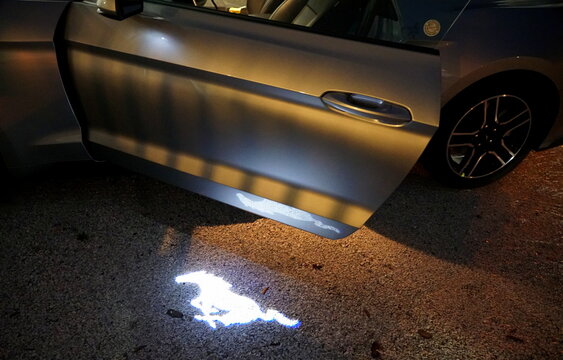 St Petersburg, Florida, U.S.A - February 16, 2021 - The Illuminated Side Door Lights Display On A Brand New 2021 Ford Mustang Sports Car 