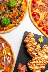 Pizza and sushi rolls for menu