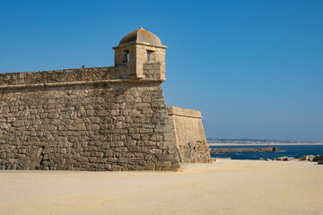 Fototapeta na wymiar Vila do Conde fort by the beach on a sunny day, in Portugal