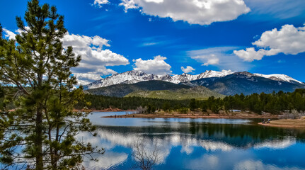 Panorama Snow-capped and forested mountains near a mountain lake, Pikes Peak Mountains in Colorado...