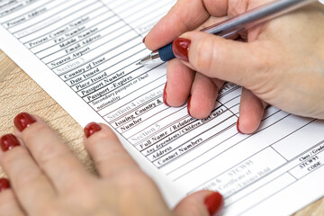 Obraz premium Filling in an application form for visa entry