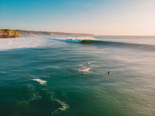 Aerial view of big wave with evening light. Biggest waves in Bali