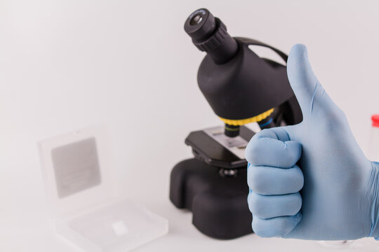 Laboratory Assistant In Blue Gloves Shows Class With His Hand