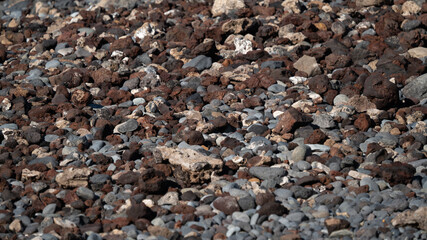 Nature background from gray sea pebbles or lava