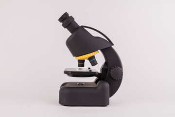 black microscope on a white background to study the microworld