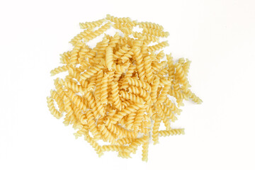 Uncooked spiral italian pasta. Fusilli isolated on white background