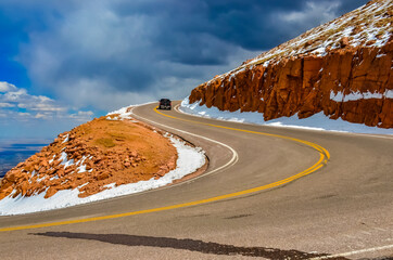 The road to the snow-covered mountain Pikes Peak, Colorado, US
