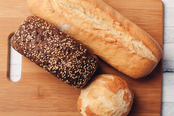 rye bread with loaf on wooden board top view food calories