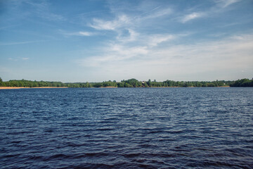 Blue lake with waves and blue sky