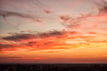 A crimson sunset over a dark city