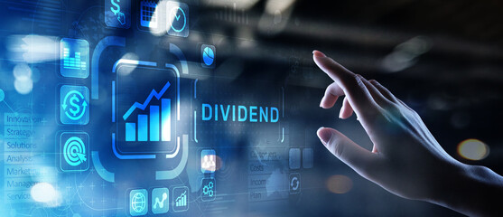 Obraz na płótnie Canvas Dividends button on virtual screen. Return on Investment ROI financial business wealth concept.