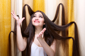 Emotional portrait of beautiful long-haired girl