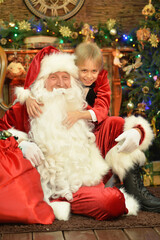 Fototapeta na wymiar Santa Claus and happy boy on Christmas