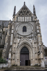 Fototapeta na wymiar Gothic building of Saint-Aignan d'Orleans (1509) - collegiate church in Bourgogne quarter of Orleans on north bank of Loire. Church is dedicated to Saint Anianus, bishop of Orleans. Orleans, France.