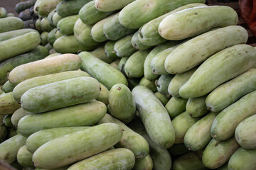 Tropical zucchini looking fruit at a street market, Mynmar