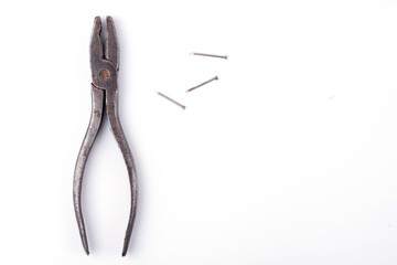 old pliers. Pastizzi on a white plate close-up.