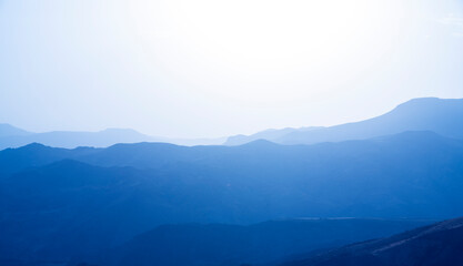 Blue mountain ranges silhouettes of mountains. 