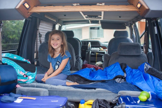 Young Girl Sleeping In A Car